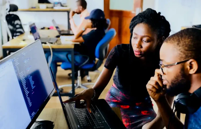 students working together on a computer